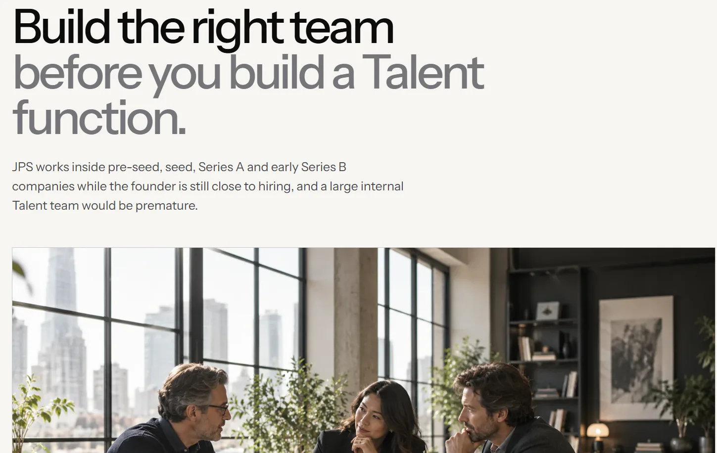 A JPS Selection page about building a team, with a photograph of three people meeting.